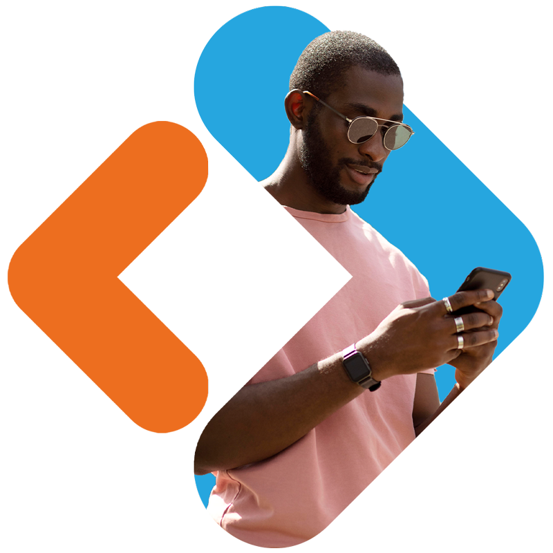 A man with a short beard and sunglasses, wearing a light pink t-shirt, a smartwatch, and rings, focuses on his smartphone. He is framed within a large, vibrant blue chevron-style shape. To his left is a matching orange chevron shape pointing left.